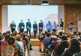 group of speakers at a conference